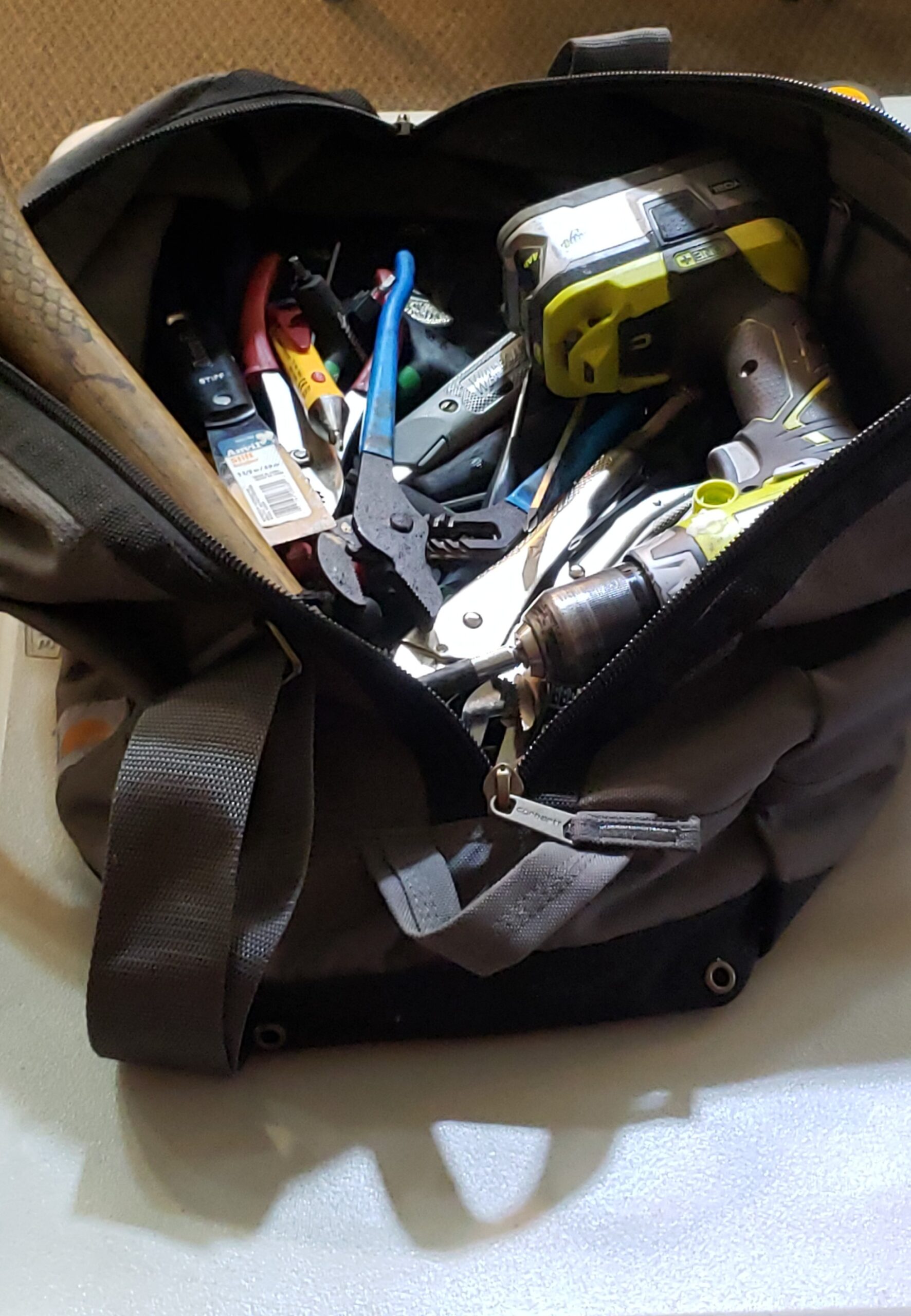 Tool bag with various tools.