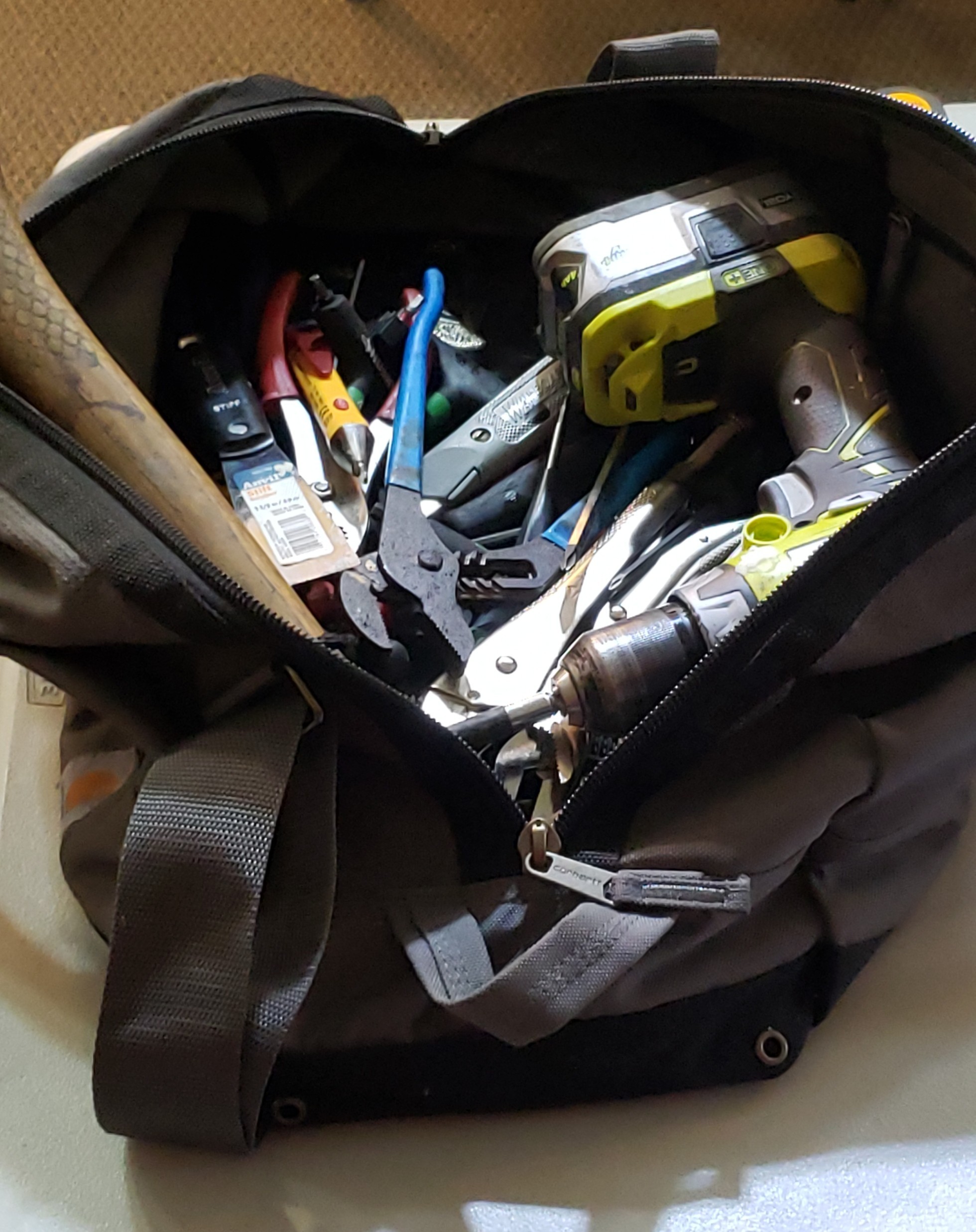 Tool bag with various tools.